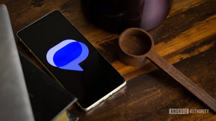 Google Messages logo on smartphone on table (1)