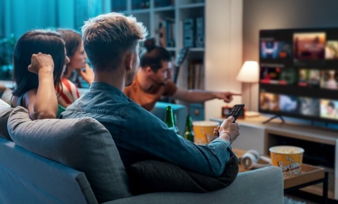 A group of friends watching TV