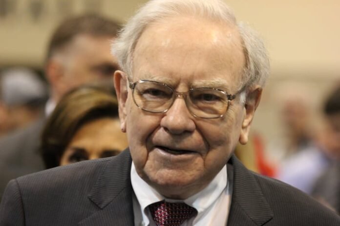 Warren Buffett looks at the camera.